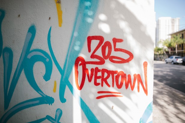 Photo of spray-painted "305 Overtown" on outside wall