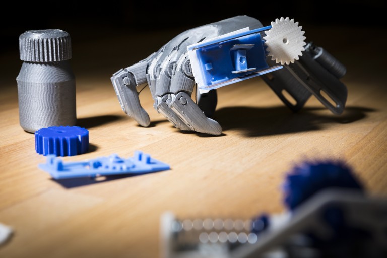 A 3D printed prosthetic hand and pill bottle