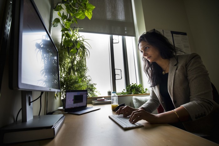 Photo of Roya Ensafi at a computer
