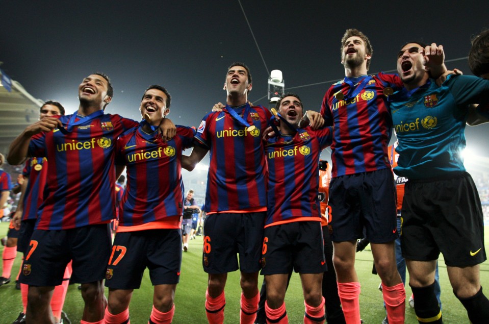 Barcelona soccer team members Jeffren, Pedro, Sergio Busquets, Xavi, Gerard Pique, and Pinto