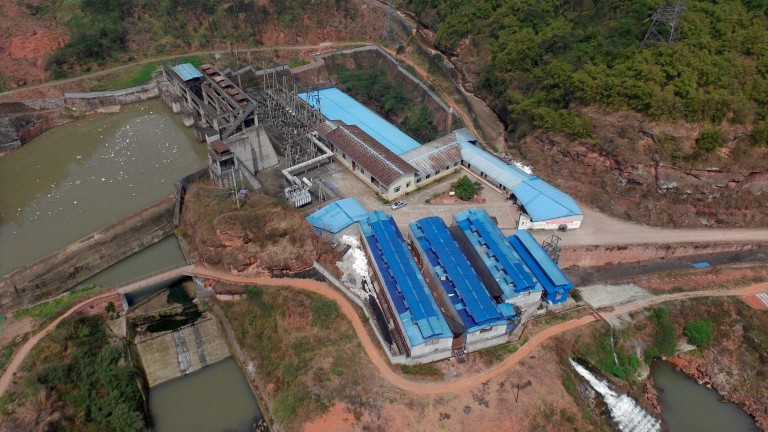 A Sichuan bitcoin mining farm by a hydropower dam