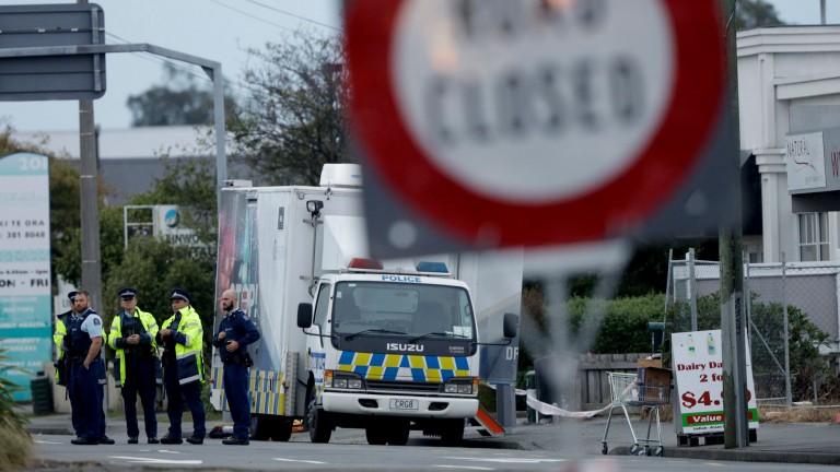 Police gather outside the Linwood mosque, site of one of the mass shootings at two mosques in Christchurch, New Zealand.