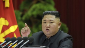 North Korean leader Kim Jong-un speaks into a microphone during a recent political conference in Pyongyang.