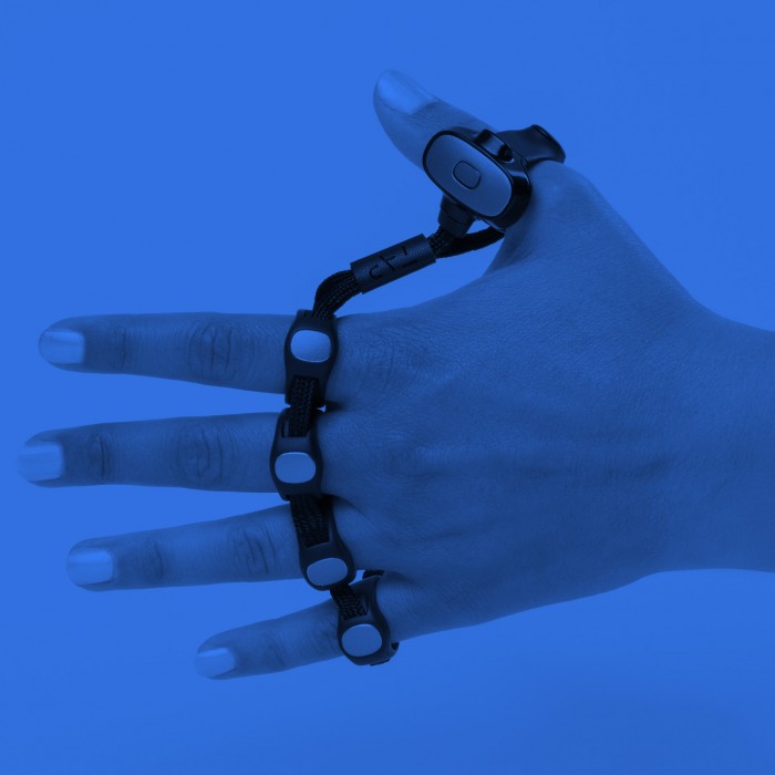Image of person wearing connected ring typing device that fits over fingers