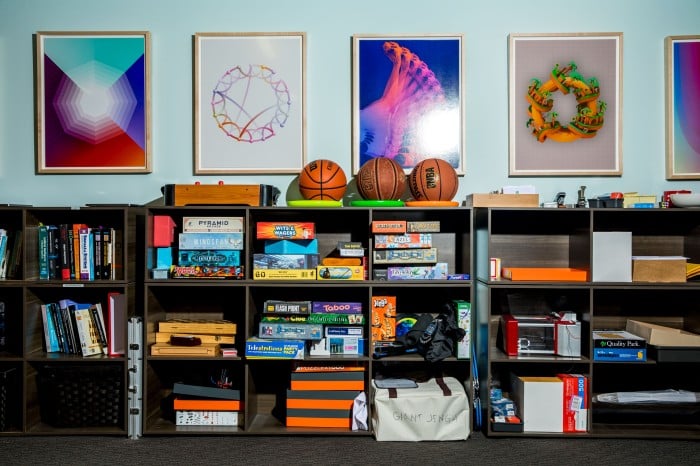 Photograph of books, games, and posters in the office space