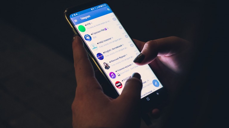 A Telegram users checks messages on a smartphone.