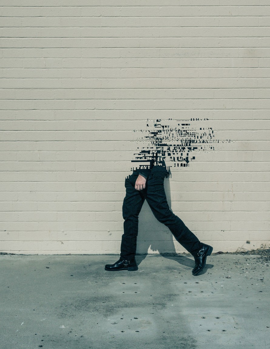 Illustration of a person walking on a sidewalk and disintegrating into the air.