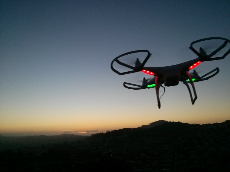 A drone flying at dusk
