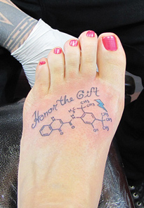 A tattoo of Kalydeco’s molecular structure top of foot.