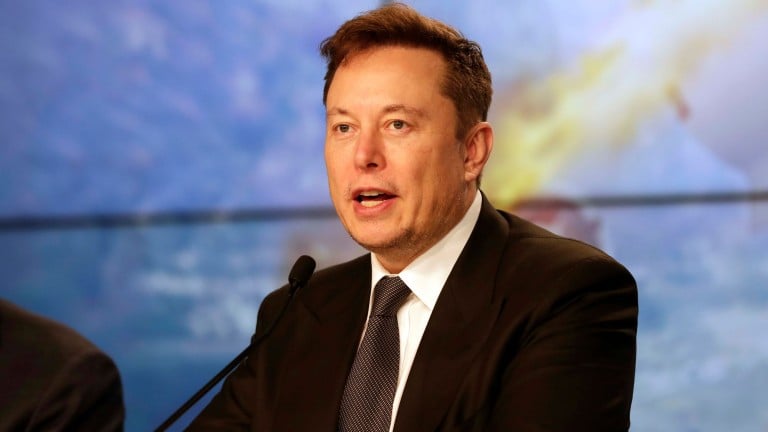 Elon Musk addresses reporters at a SpaceX press conference