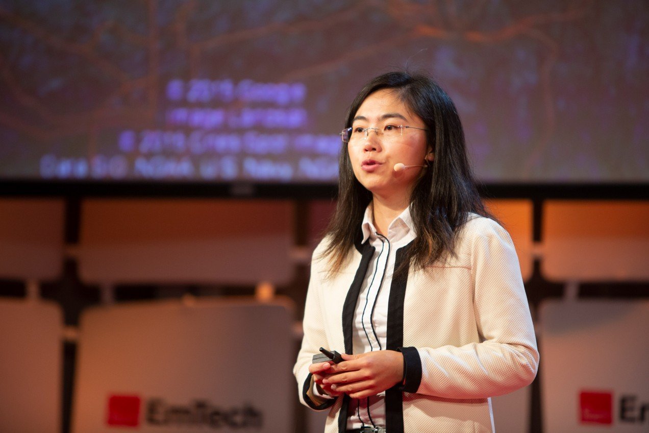 Photo of Fei Fang speaking at EmTech 2018