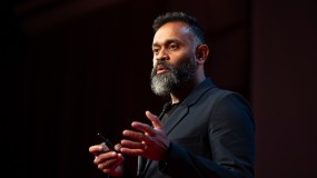 Photo of Ganesh Bell speaking at EmTech 2018