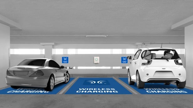 Rendering of cars on charging platforms in parking garage.
