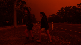 Photo of residents as they watch the developing conditions near the town of Sussex Inlet on December 31, 2019 in Sydney, Australia.