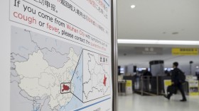 Poster of Wuhan quarantine instructions in an airport in Japan
