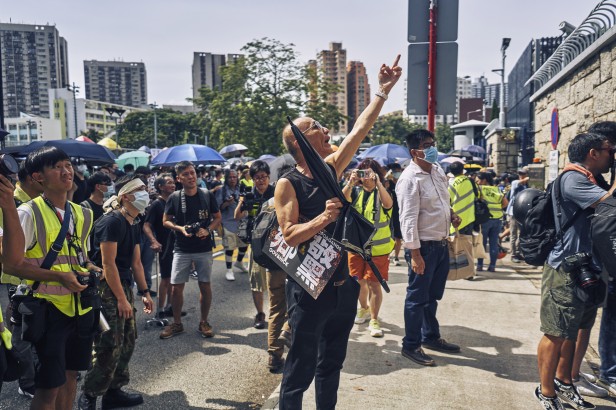 Protestors outside of the Yuen Long Police Station, expressing their distrust and displeasure with how the police responded to the triad attacks at the Yuen Long West Rail Train Station. Yuen Long, New Territories, Hong Kong. July 27th, 2019.