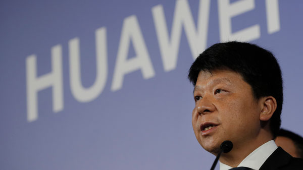 Huawei's rotating chairman Guo Ping addresses reporters in Shenzhen, China