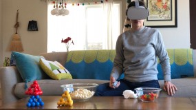 Image of woman in living room wearing VR headset
