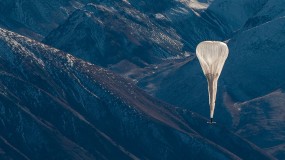 Photo of Loon Ballon flying above mountains
