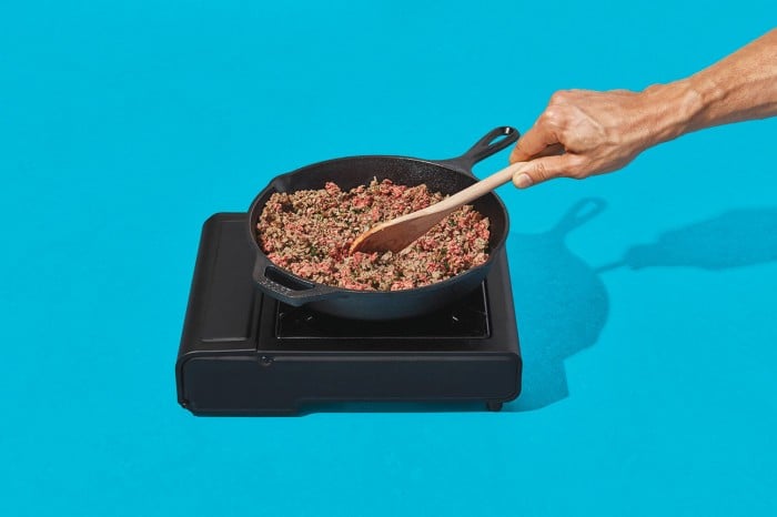 Photo of impossible burger meat being cooked in a pan