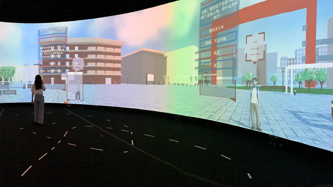 An image of students standing in the immersive virtual environment