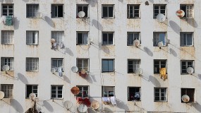 An image of windows with satellite dishes