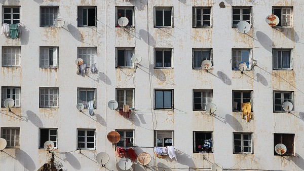 An image of windows with satellite dishes