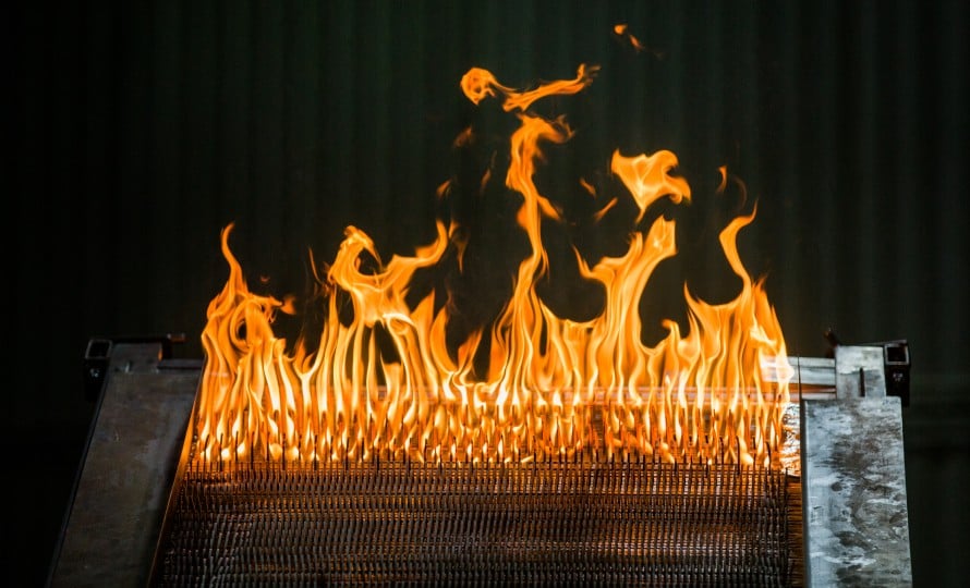 An image of “Little Bertha,” which is packed with high cellulose cardboard and MDF. As the cardboard and MDF burns, it demonstrates the spread of fire up a slope, and to also shows a very specific “U formation” the flames take on.