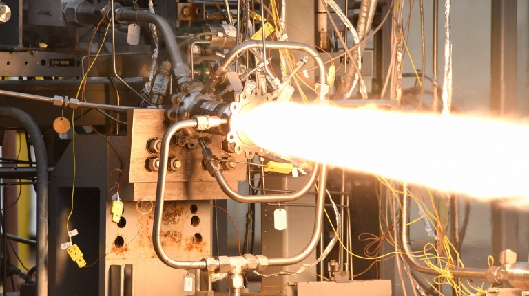 Image of engineers test-firing a 3D-printed rocket engine combustion chamber at NASA’s Marshall Space Flight Center in Huntsville, Alabama.