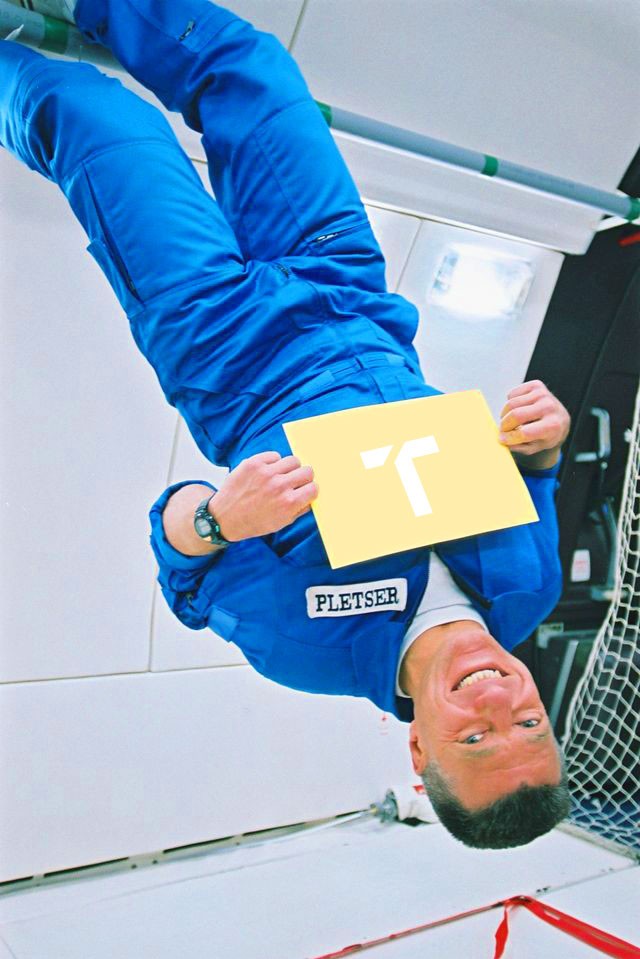 Man in aircraft floating upside down