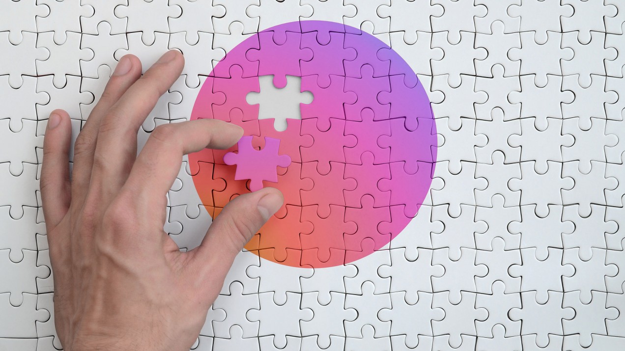image of hand placing gradient puzzle piece instagram colors