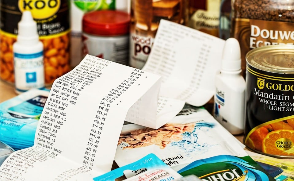 An image of a grocery receipt and grocery items