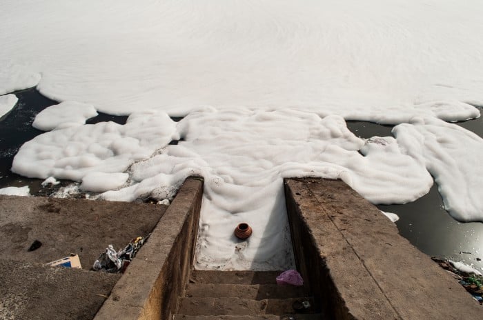 A photograph of the polluted Yamuna river