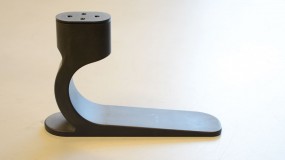 A prototype of a single-part, low-cost prosthetic foot made of nylon.