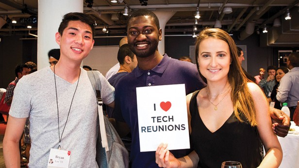 Photo of three people, one holding a sign reading "I Love Tech Reunions"