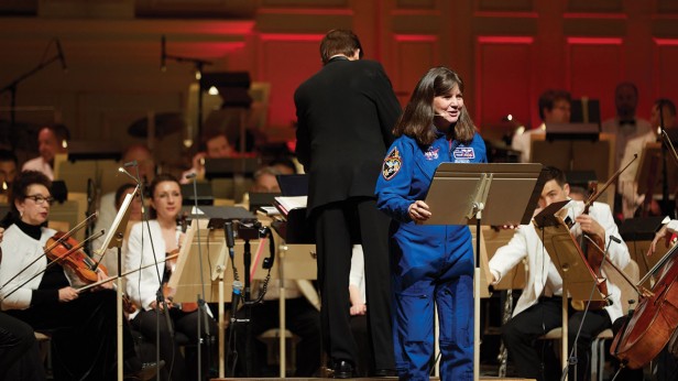 Retired astronaut Cady Coleman ’83 narrates a special performance of the new musical work From the Earth to the Moon and Beyond for an all-MIT Symphony Hall crowd at Tech Night at Pops.