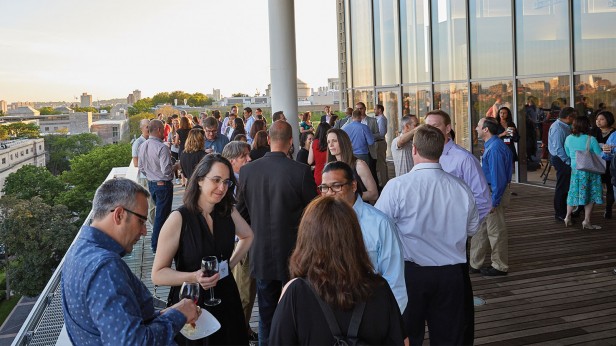 On the top floor of the MIT Media Lab, the Class of 1994 celebrates its quarter-century reunion against sunset-lit views of Boston and Cambridge.