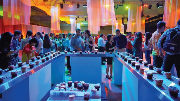 At Toast to Tech, partiers take a break from dancing to the live band in Johnson Athletic Center and grab a treat from the cupcake conveyor belt.