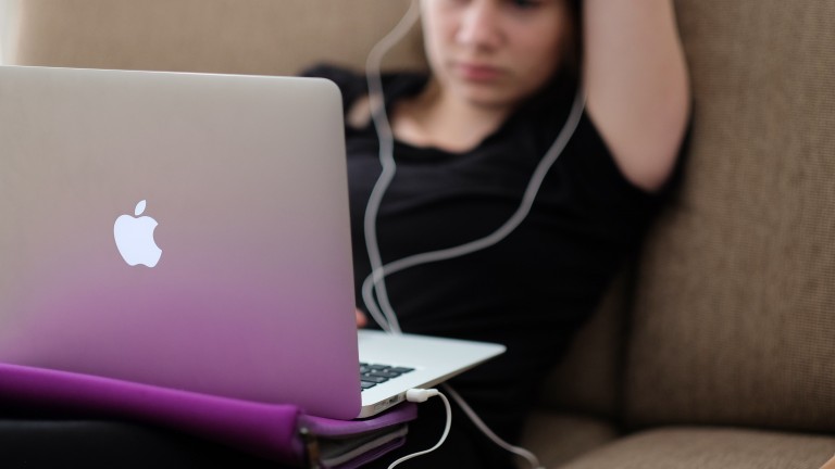 image of teen young woman girl using computer and phone apple imac