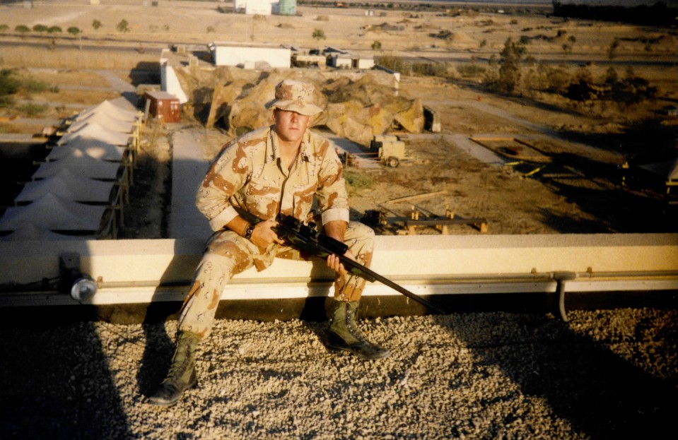 Swofford in army clothing holding a gun