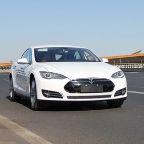 white Tesla on the road