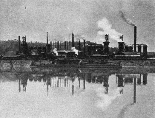 B&W photo of factories and smoke stacks