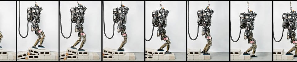 Montage of Atlas robot walking over cinder blocks while tethered