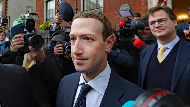 Mark Zuckerberg leaves a shareholder meeting